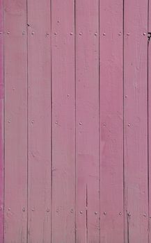 Close up background texture of pink vintage painted wooden planks, rustic style wall panel