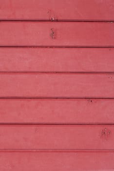 Close up background texture of pink vintage painted wooden planks, rustic style wall panel