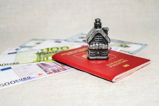 Passport, money and home - the concept of buying a property.