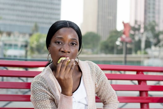 This young woman is eating an apple because it is nutritious.