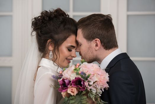 Bride and groom with bridal bouquet ready for wedding