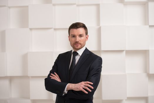 Portrait of man in black suit, groom, businessman concept