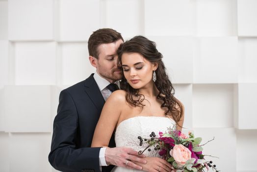 Bride and groom with bridal bouquet ready for wedding