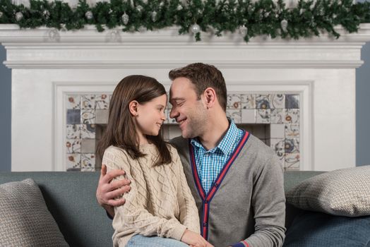 Family portrait of happy father and his daughter at home