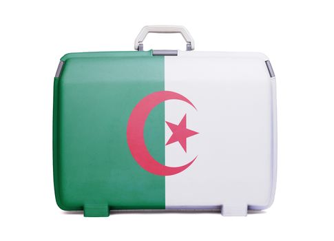 Used plastic suitcase with stains and scratches, printed with flag, Algeria