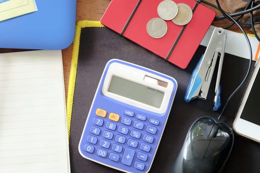 Top view of office supplies on a wooden table background,  Business workplace and business objects.