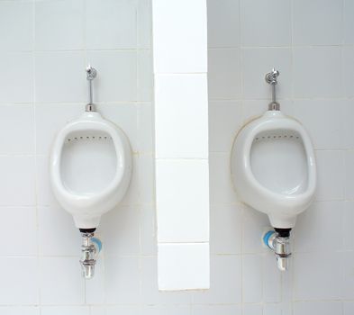 White ceramic sanitary ware in restroom