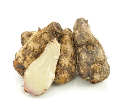 taro roots on white