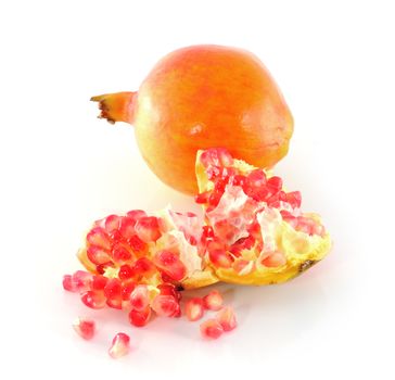 Ripe pomegranate fruit isolated on white background cutout