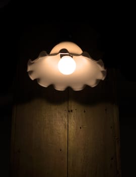 Lamp on a wall shining