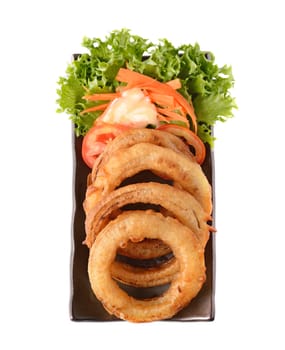 onion rings on a plate on white background