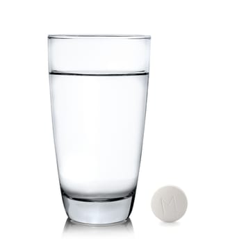 Glass of water and pills isolated on white background