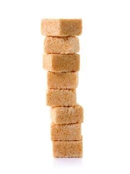 Cubes of cane sugar isolated on white background