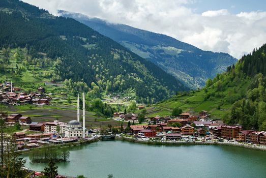 One of the most beautiful tourist places in Turkey. Uzungol - a mountain valley with a trout lake and a small village.