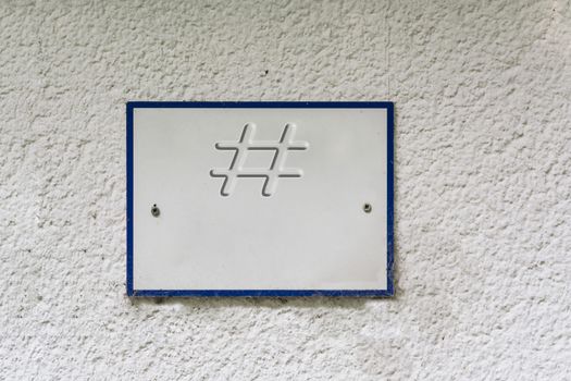 Information sign or board on a house wall with lettering #