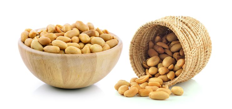 peanuts in the basket and wood bowl on white background