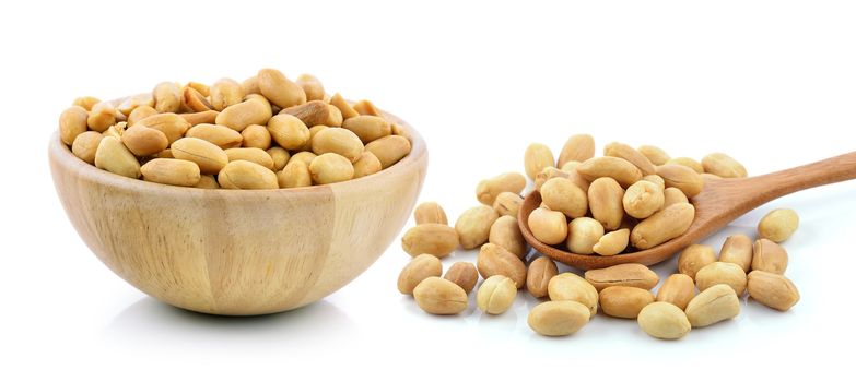 peanuts in a wood bowl on white background