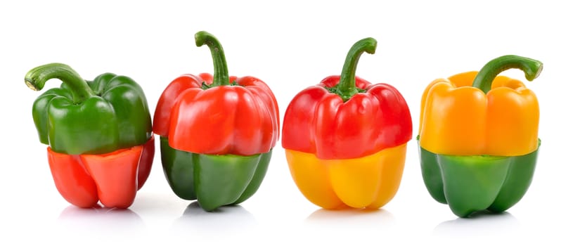 red and green pepper over white background