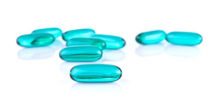 Blue pills capsule on white background