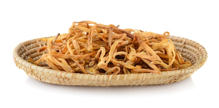 Dried Day Lily in basket on white background