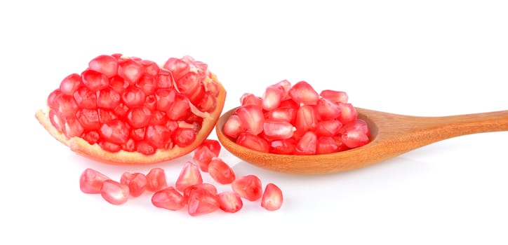 Pomegranate fruit seeds on white background