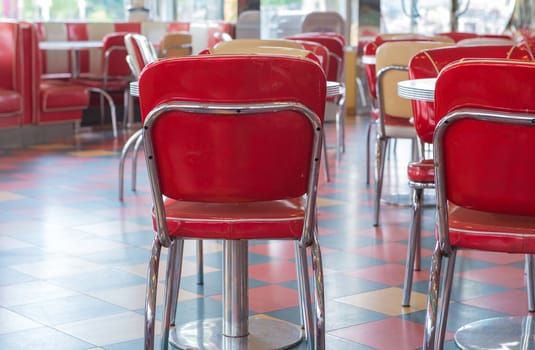 red table and chairs vintage style in restaurant.