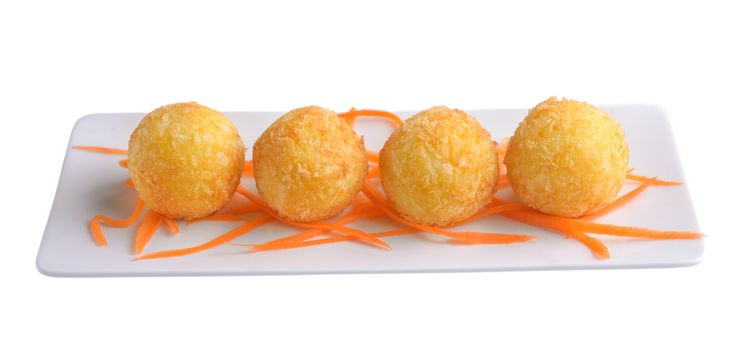 cheese ball in white plate on white background