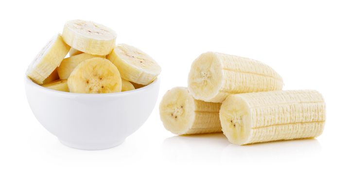 slice banana in bowl on white background