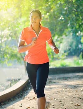 woman running outdoors in park