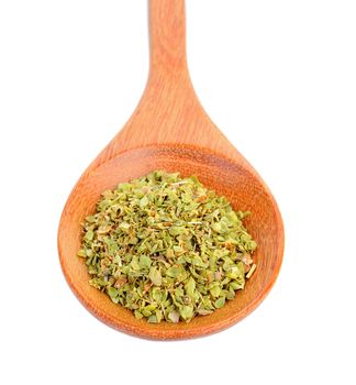 Dried Oregano in wood spoon on white background