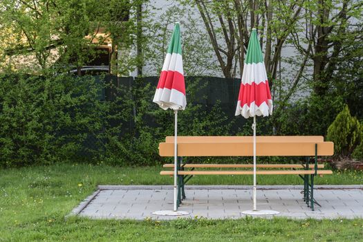 Closed parasols with the national colors of Italy