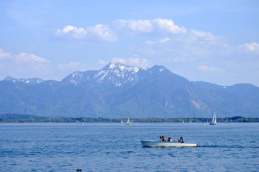 Landscape Chiemsee with boat in spring