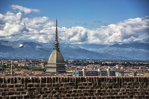 Panoramic view of Turin city center, in Italy, in a sunny day, with Mole Antonelliana and Alps in the background