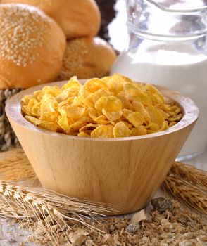 corn flakes in wood bowl 