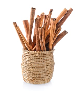 Cinnamon in basket on white background