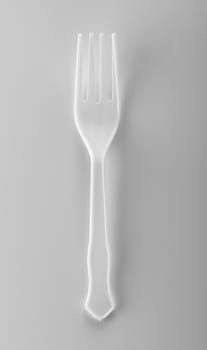 plastic forks on white background