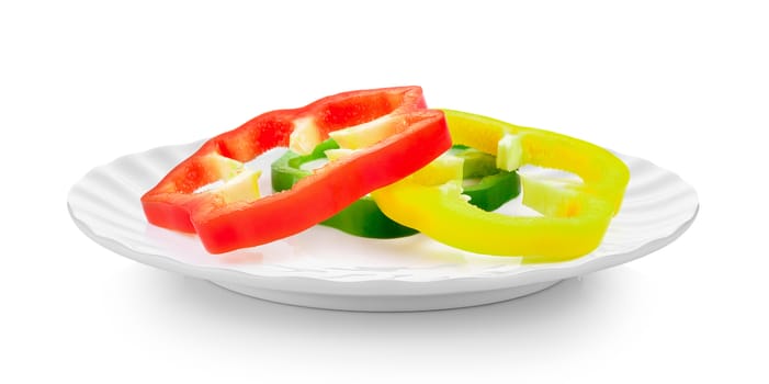 Sliced pepper in white plate on white background