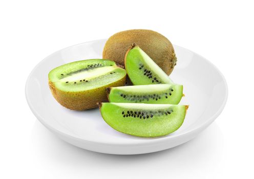 Juicy kiwi fruit in plate on white background