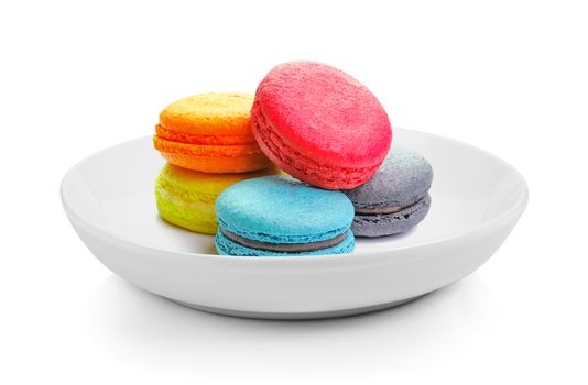 macarons in plate on white background