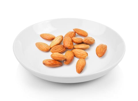 almond in plate on white background