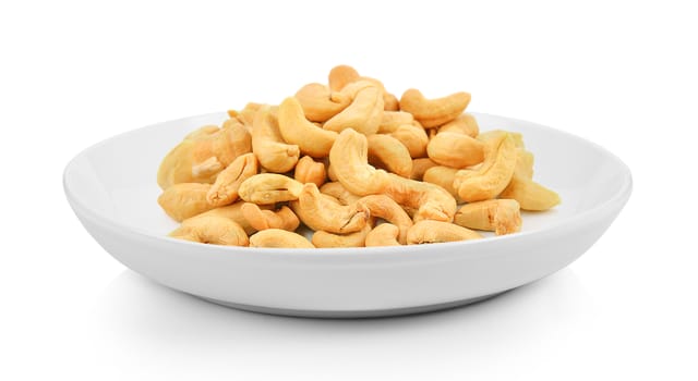 cashew nuts in plate on white background