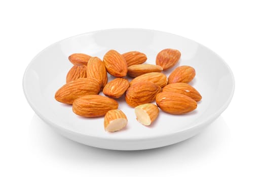 almond in plate on white background