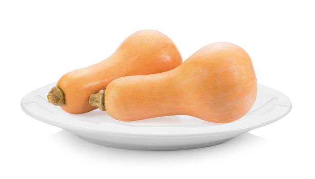 butternut squash in plate on white background