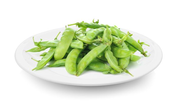 green beans in plate on white background