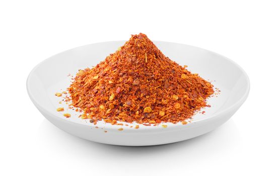 Cayenne pepper in a plate on white background