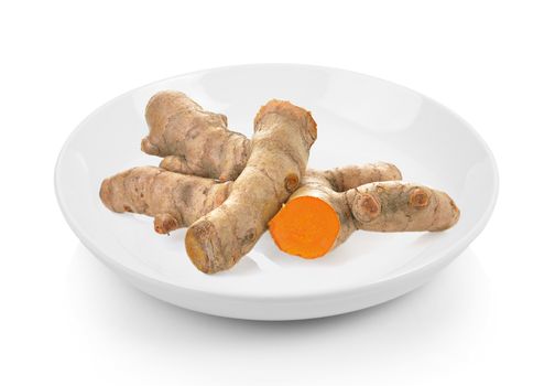 turmeric in plate on white background