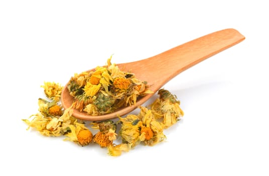 dried chrysanthemum flowers in wood spoon