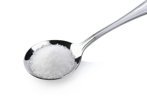 sugar in spoon on white background
