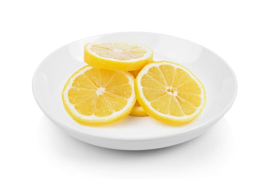 Fresh lemon slices in plate on white background