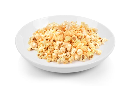 Popcorn in plate on white background